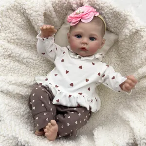 Realistic 46cm reborn baby doll Meadow wearing heart print outfit and floral headband