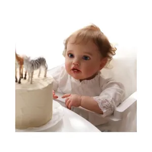 Lifelike 60cm reborn baby doll with visible veins wearing a white lace dress