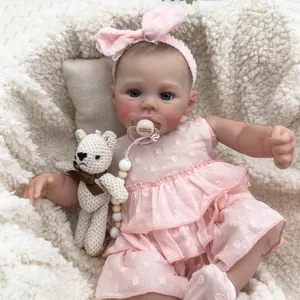 Realistic 49cm reborn baby doll in pink polka dot dress with I love Mommy pacifier