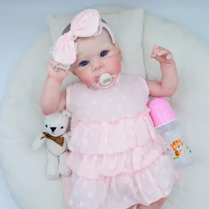 18 inch realistic Bettie reborn baby doll in pink polka dot dress with pacifier