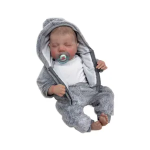 Realistic 49cm reborn baby doll Levi sleeping in a grey plush hooded outfit with pacifier