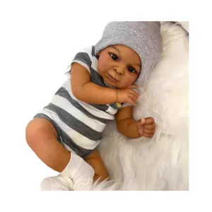 Realistic 23-inch deep skin tone reborn baby doll Jaylan wearing striped romper and hat