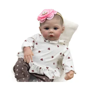 Reborn baby doll Meadow 46cm with lifelike skin details and floral headband