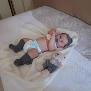 50cm full silicone reborn baby doll in knit outfit with plush bear accessory