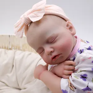 Lifelike 49cm reborn baby doll with 3D skin texture sleeping in a woven basket