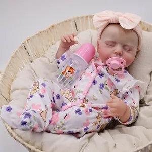 Lifelike 49cm reborn baby doll with 3D skin texture, floral outfit and feeding bottle