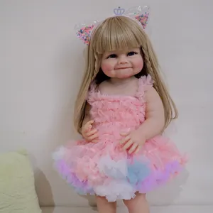 55cm Raya reborn baby doll with blonde hair and pink lace dress in a studio setting