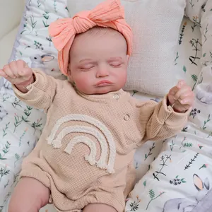 Realistic 48cm Reborn Baby Doll Rosalie in beige knit romper and pink bow headband