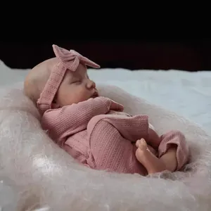 Realistic 19 inch reborn baby Levi doll in pink knitted outfit with headband