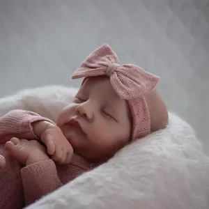 Realistic 19 inch Levi reborn doll with 3D skin texture in pink baby outfit