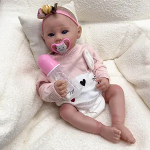 Poupée bébé reborn Raven de 50 cm en pull rose à oreilles de lapin avec tétine et biberon