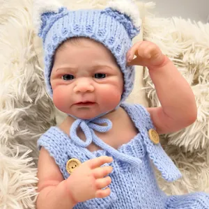 Realistic 49cm newborn Elijah reborn baby doll in light blue knit outfit with bear ear hat