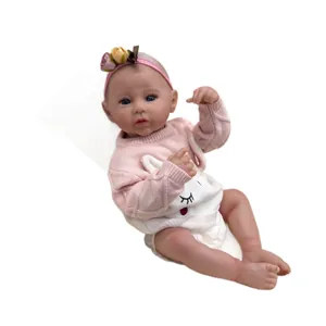 Poupée bébé reborn réaliste de 50cm avec yeux bleus et pull en tricot lapin rose
