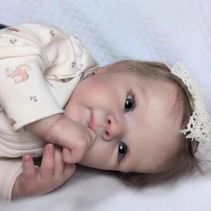 Realistic 18-inch reborn baby doll in squirrel print romper and lace headband