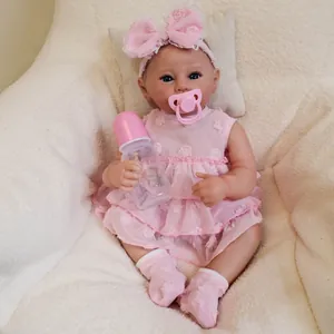 Realistic 49cm reborn baby doll Raven in pink lace dress with pacifier and bottle