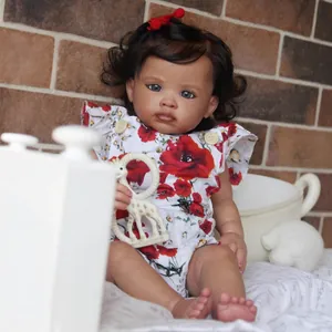 55cm lifelike reborn baby girl doll with curly hair, poppy dress and giraffe plush