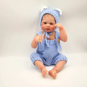 Realistic 49cm Elijah reborn baby doll in light blue hand-knitted outfit and cute bear hat