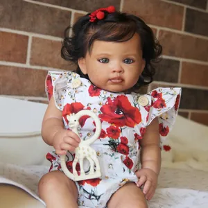Realistic Reuben reborn baby girl doll with dark curly hair and giraffe toy