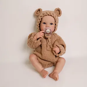 18-inch Bettie reborn baby doll in brown bear knit hoodie with I love Mommy pacifier