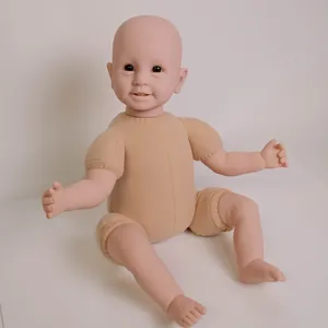 Realistic 22-inch reborn baby doll with cloth body and detailed vinyl limbs on white surface