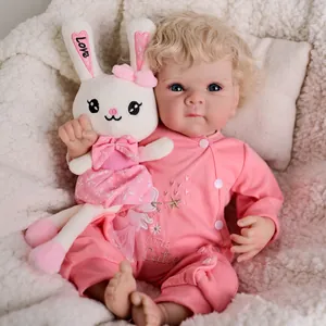 48cm reborn baby doll Bettie with blonde curly hair, blue eyes and pink romper set
