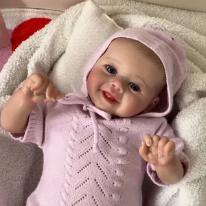 Poupée reborn réaliste de 48cm avec pull rose tricoté, yeux bleus et bonnet assorti