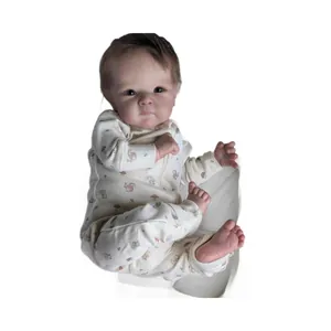 Lifelike 18-inch Bettie reborn baby doll wearing a forest-themed white romper