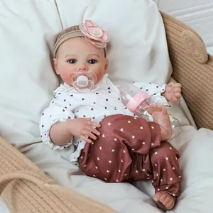 Realistische 46cm herboren babypop Meadow met bloemen hoofdband en I love Daddy speen