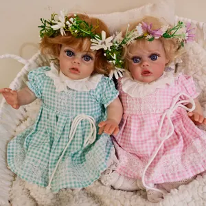 Twin 12-inch realistic fairy reborn baby dolls in pastel checkered dresses and floral crowns
