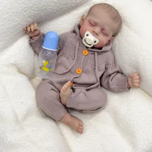 Lifelike 19-inch Erica reborn baby doll in purple knit romper with feeding accessories