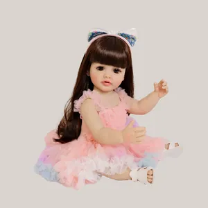 Lifelike 55cm reborn baby doll Betty with brown hair in pink tiered tulle dress and headband