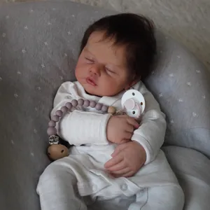 Realistic 19-inch reborn baby doll sleeping in ribbed romper with pacifier clip