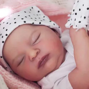 Realistic 19-inch reborn baby doll sleeping with polka dot hat and pink blanket