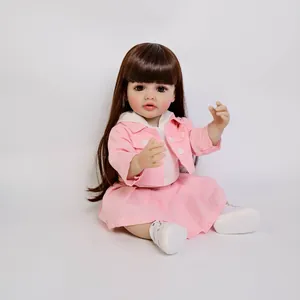 55cm lifelike reborn baby doll Betty with brown hair and pink outfit in sitting pose
