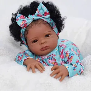 19-inch realistic reborn doll Lanny with dark skin, curly black hair and floral outfit