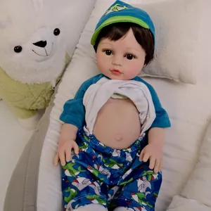 Realistic 18-inch reborn baby doll in shark outfit lying in a cozy cradle