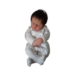 Realistic 19-inch sleeping reborn baby doll in white long-sleeve onesie on white background