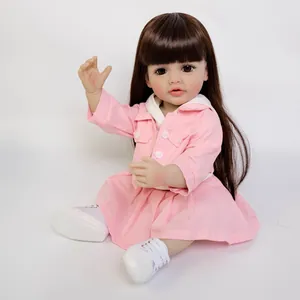 Reborn baby doll Betty with brown hair in pink outfit and white sneakers