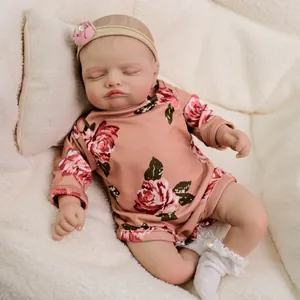 Lifelike 18 inch Rosalie reborn sleeping baby doll in floral romper and pink headband