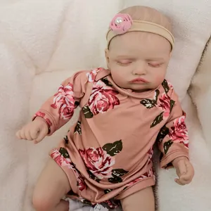 Realistic 18 inch reborn baby doll Rosalie sleeping in floral romper and headband