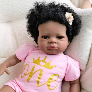 19-inch realistic Lanny reborn doll with dark skin, curly hair and pink crown bodysuit