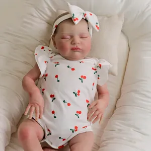 Realistic 19-inch sleeping reborn baby doll in cherry print romper with matching headband