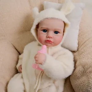 Realistic 19-inch baby doll wearing a white bunny plush outfit with a pink bottle