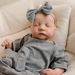 Realistic 18 inch reborn baby Levi doll in grey ribbed romper with bow headband sleeping