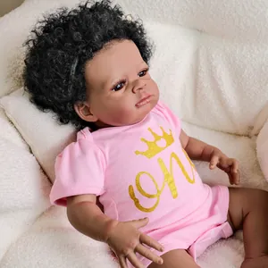 Realistic 19-inch African American reborn baby doll with afro hair and pink crown outfit