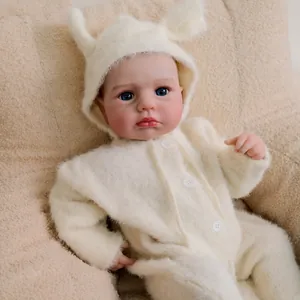 Realistic 19-inch reborn newborn baby doll wearing a soft white plush rabbit jumpsuit