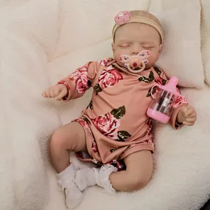 Reborn baby doll Rosalie in pink floral bodysuit with magnetic pacifier and bottle