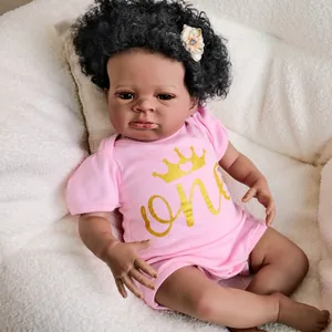 Realistic 19 inch black reborn baby doll Lanny in pink one crown outfit and flower headband