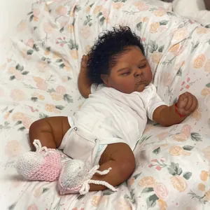 Realistic 19-inch reborn doll with dark skin tone, black curly hair, and white bodysuit