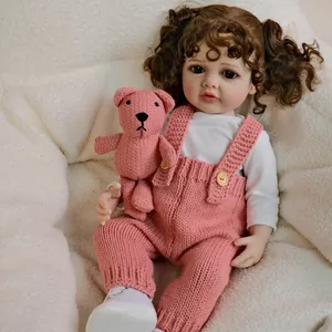 55cm lifelike reborn doll Betty in pink knitted overalls with a crochet bear toy